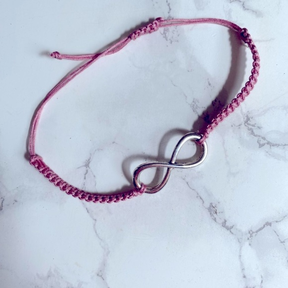 Handmade infinity bracelet. Adjustable to wrists.